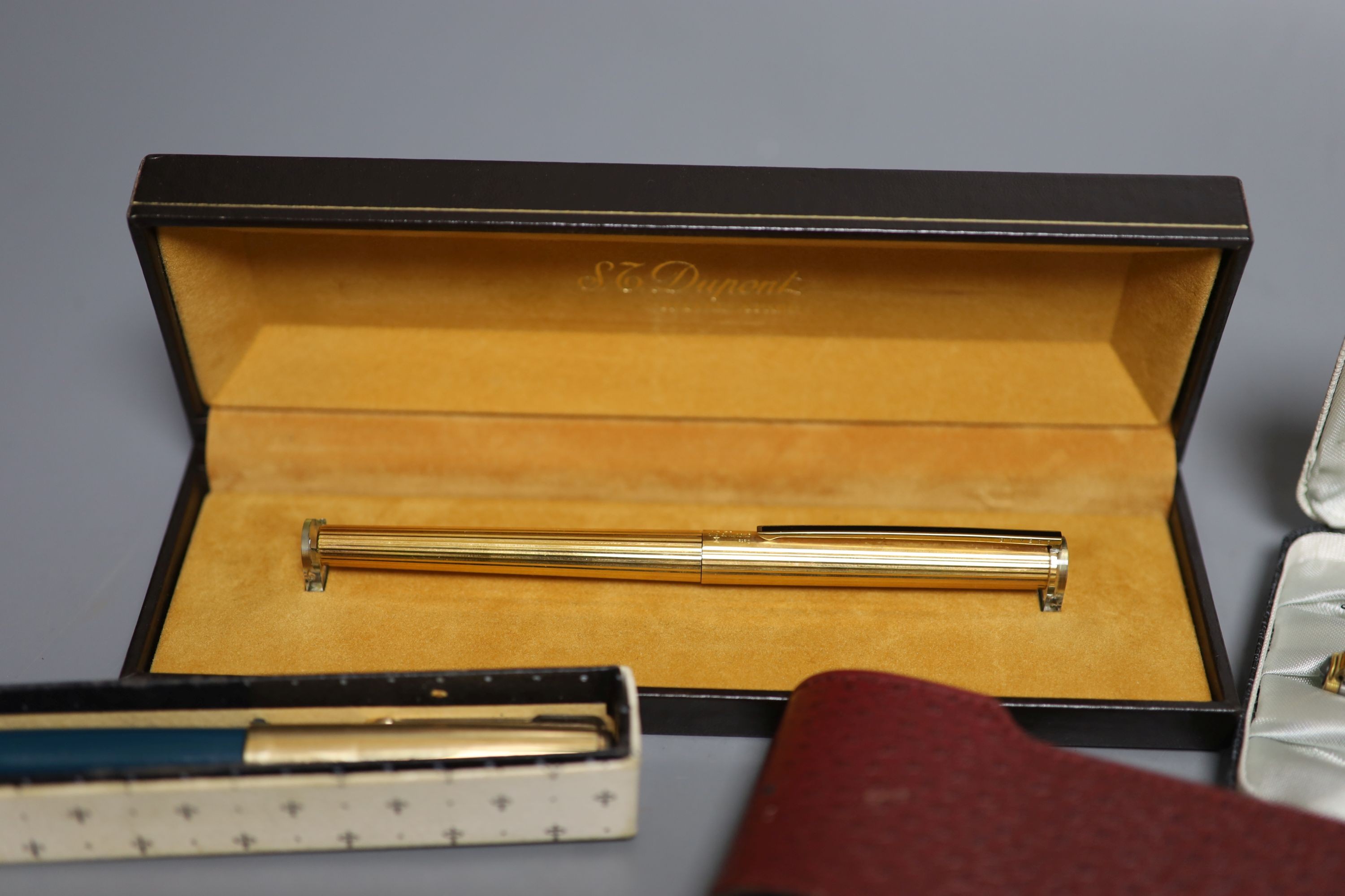 A Parker pen trio, boxed Parker fountain pen, other pens and pencils